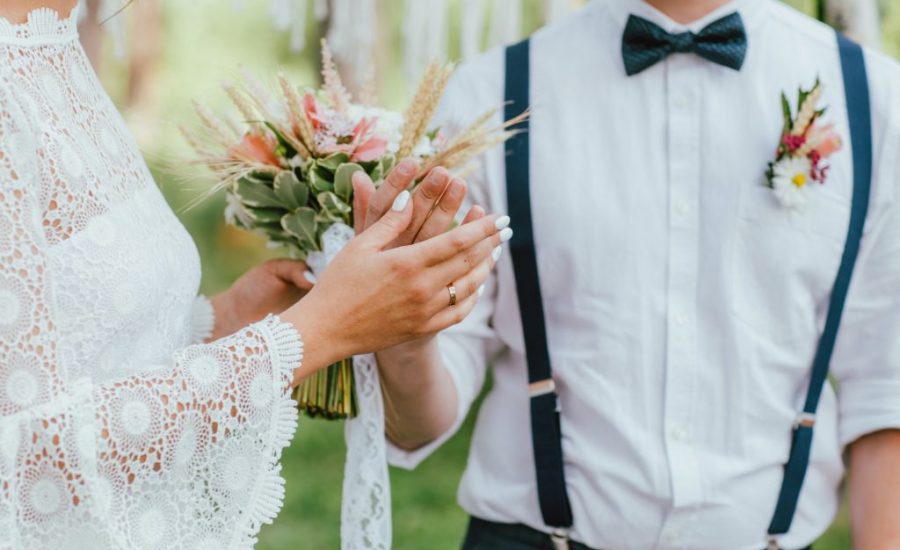 crop-photo-of-bride-young-woman-with-the-boho-style-bouquet-with-groom-on-wedding.jpg