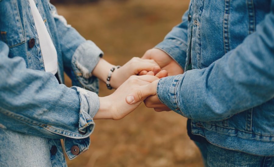 gentle and stylish couple are having a walk in the autumn park